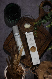 Fika serum placed on vintage wooden board evoking a feel of slow skincare for sensitive skin