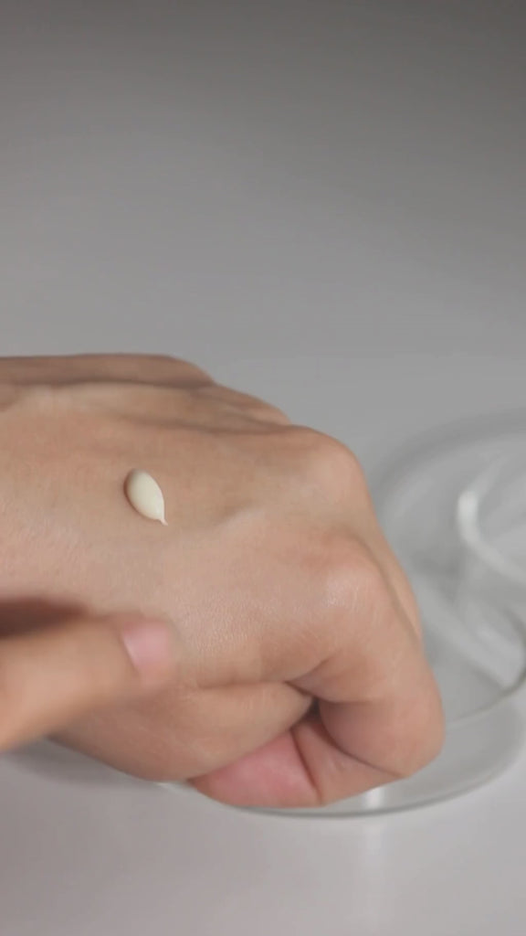 Creamy dewy texture of Fika pigmentation serum spread on skin showing lightweight milky consistency