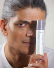 Man holding Terra barrier repair serum for dehydrated sensitive skin